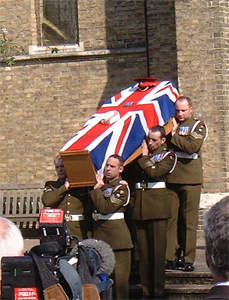 The coffin leaves the church