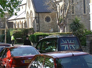 The hearse departs